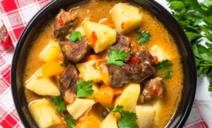 Bosanski lonac with chunks of meat, potatoes, and vegetables in broth
